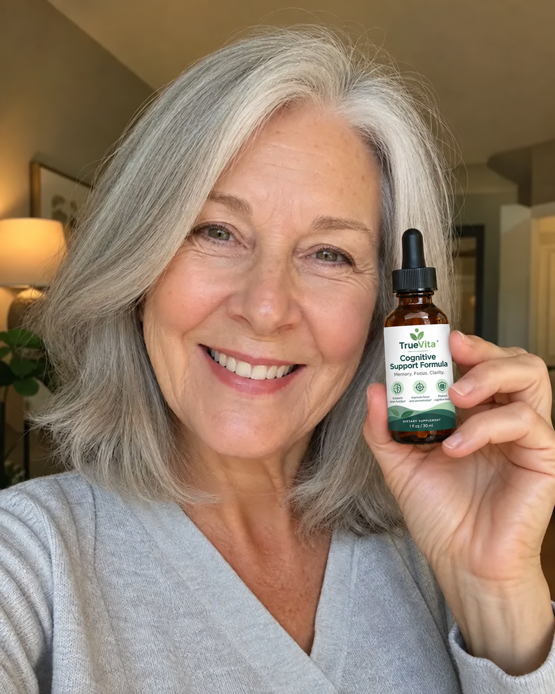 Eleanor P., 68 — TrueVita customer holding her bottle